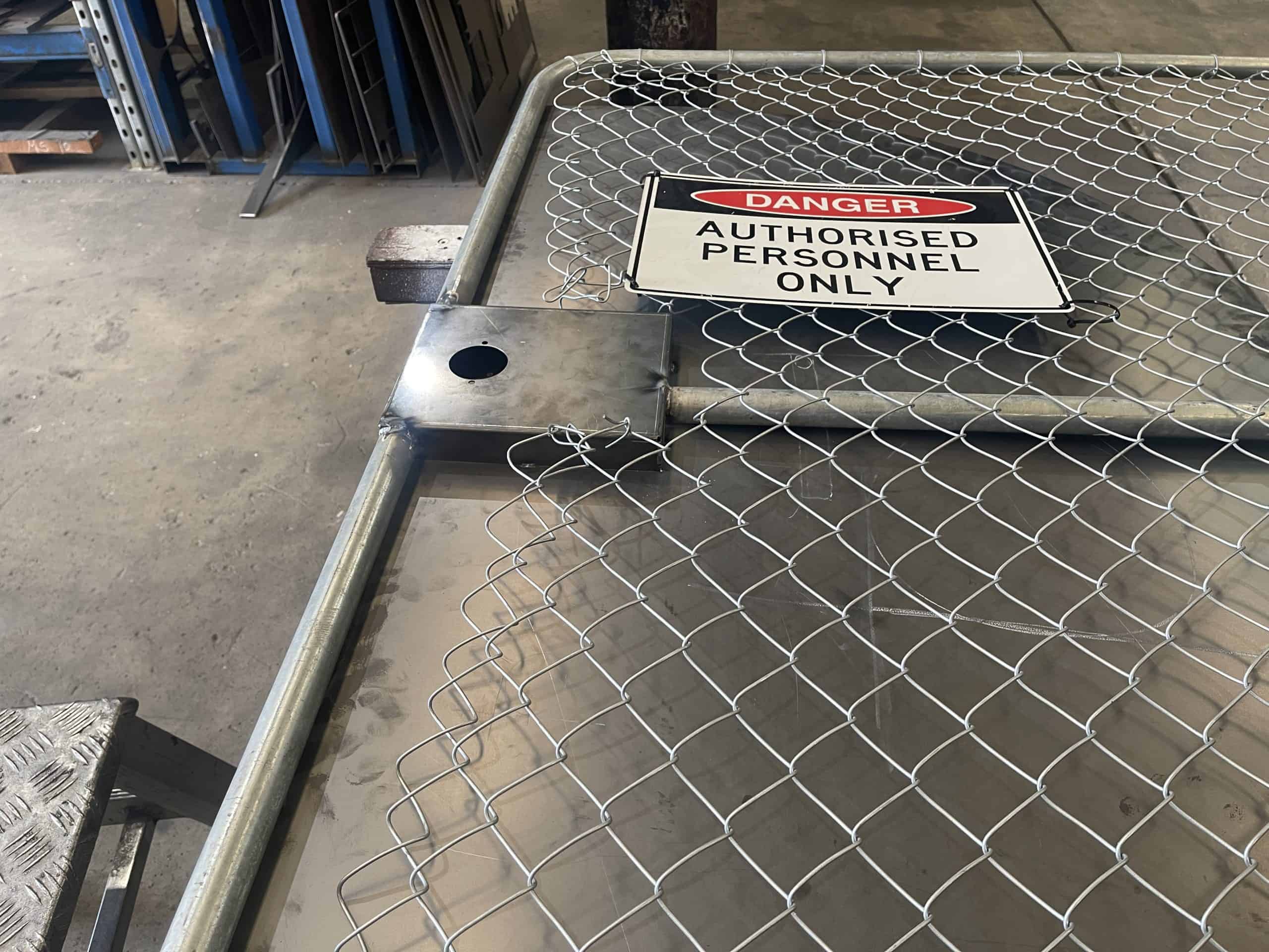 keenworx metal gate with danger sign metal fabrication