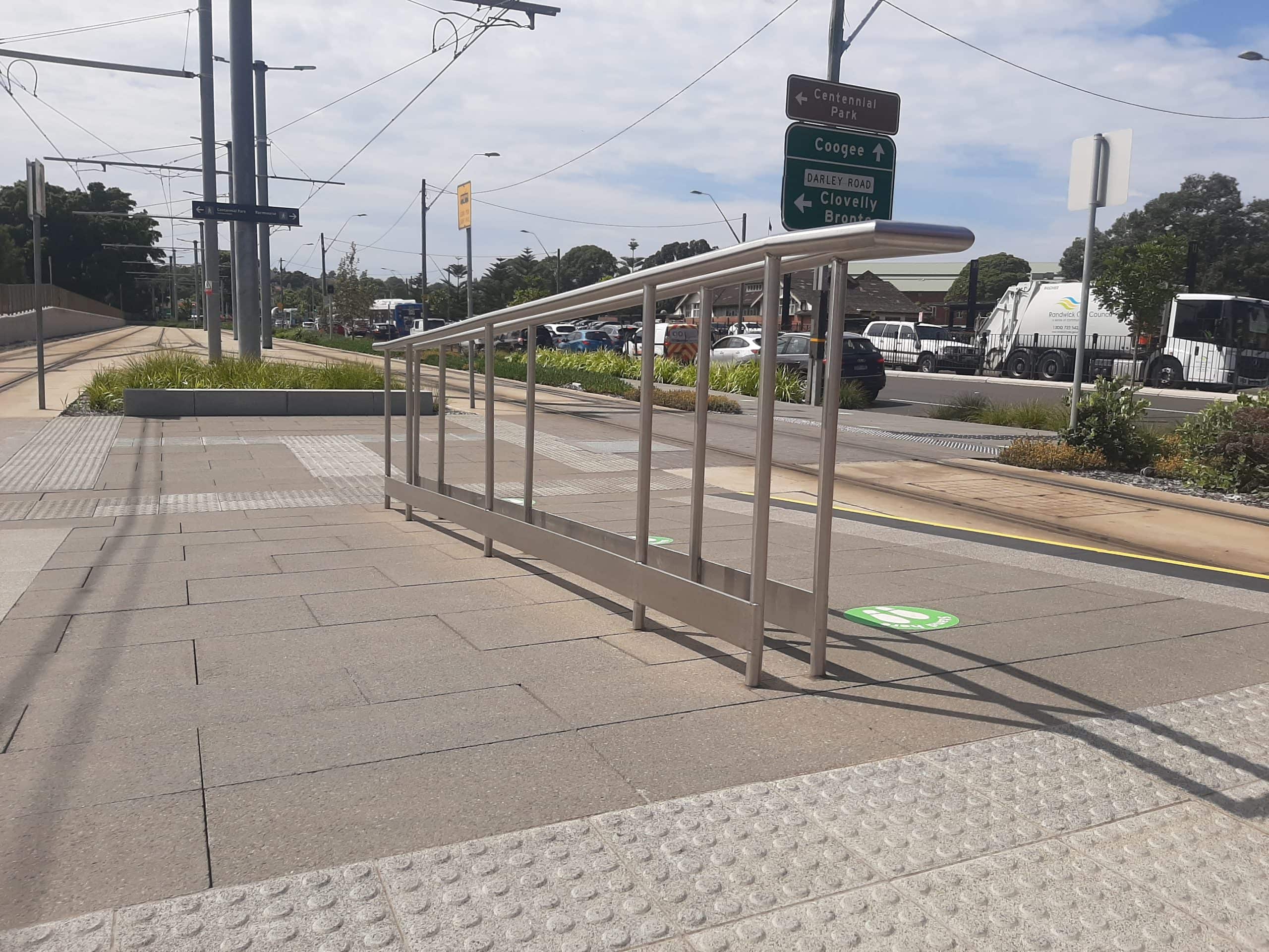 keenworx royal randwick train station nsw metal handrail with road signs custom metalworks