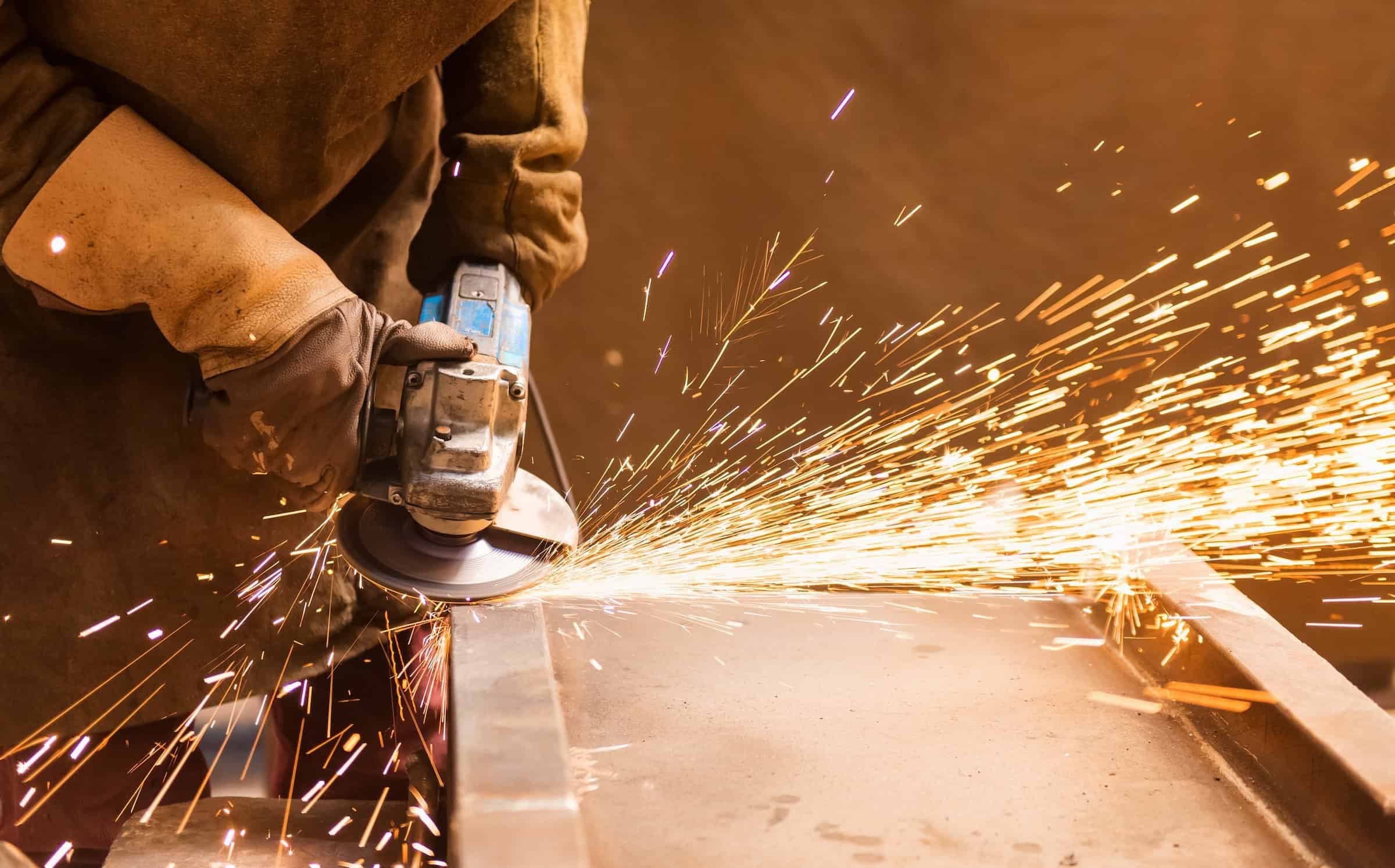 keenworx young man welding in a factory flipped